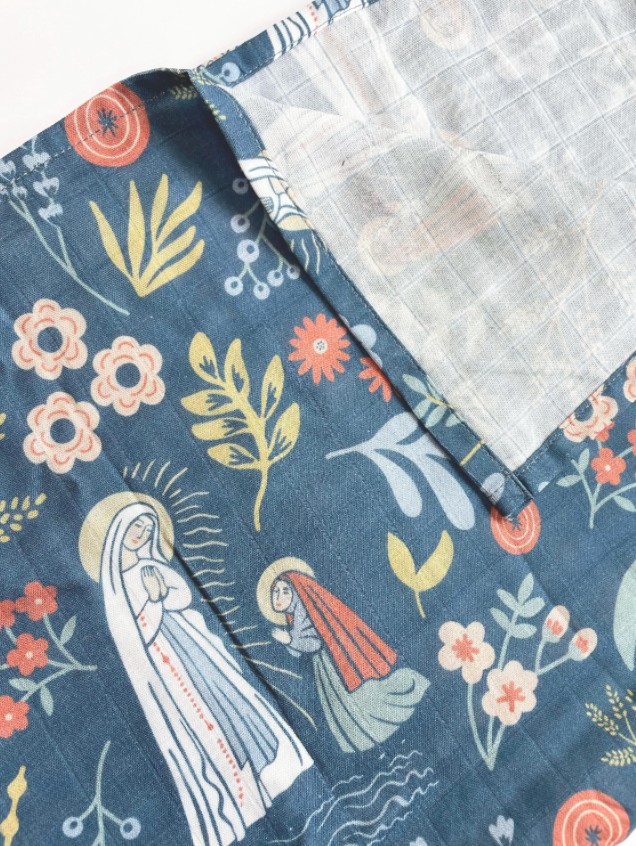 Our Lady of Lourdes and St. Bernadette Muslin Blue Swaddle